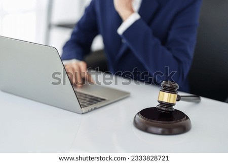 Lawyer working legal data contract at workplace.

