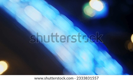 Bokeh lights of a night road in the city, timelapse. Blurred light of headlights and lanterns during a traffic jam on a dark road, top view