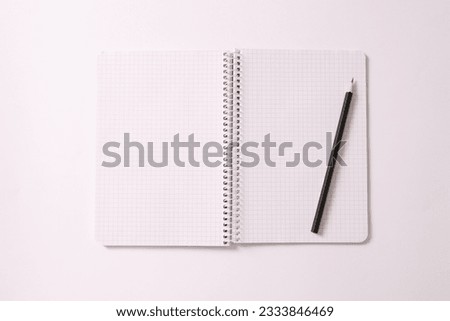 notepad with pencil on white background, space for text