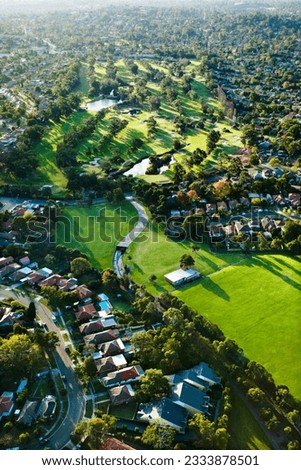 Aerial view of Ryde Parramatta Golf Course and buildings in West Ryde, Australia.