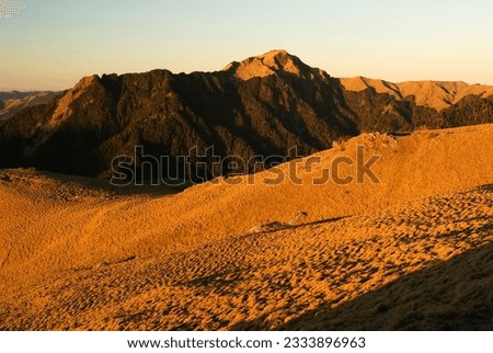 The sunrise golden beautiful high mountain landscape.