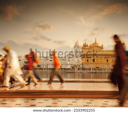Group of Sikh pilgrims walking by the holy pool, Golden Temple, Amritsar, Pun jab state, India, Asia