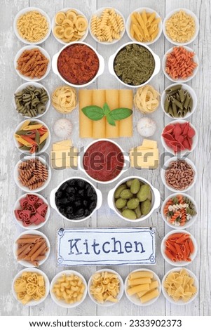 Mediterranean diet food selection with old metal kitchen sign forming an abstract background over distressed white wood.