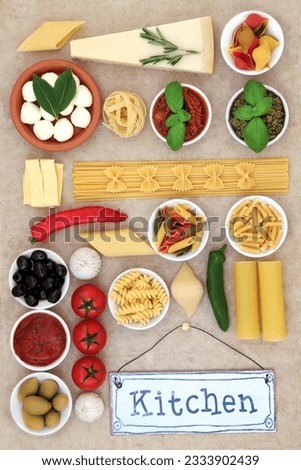 Healthy mediteranean diet and food ingredients with old kitchen sign forming an abstract background over natural hemp paper background.