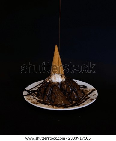 Chocolate cake with chocolate creame isolated on black 