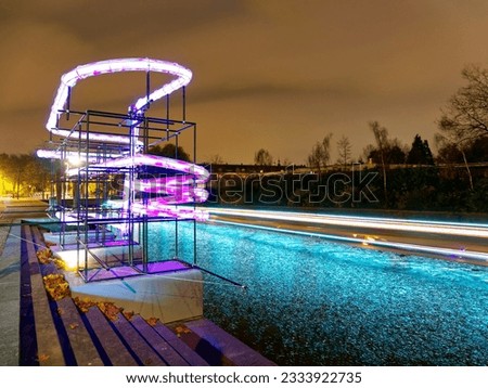 Light trails in canal during light festival night, Amsterdam, Netherlands