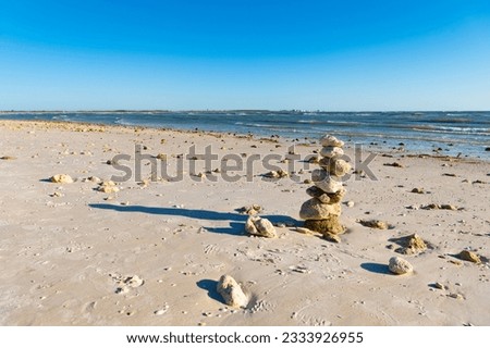 zen pebble at beach. nature balance concept. zen like summer. stone pyramid at sea. copy space banner. life equilibrium. balance and harmony in life. harmony and balance