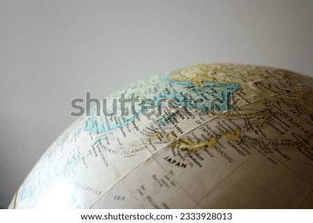 Macro image of globe highlighting East Asia