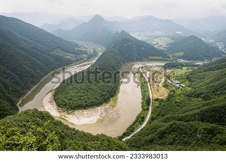 river flowing through the mountains Royalty-Free Stock Photo #2333983013