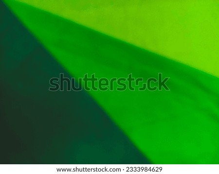 Bandung, July 19, 2023 : Disfocus of green light green nylon fabric part of bags surface for background or wallpaper at home.