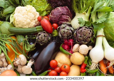 Background of mixed fresh organic vegetables and herbs. Royalty-Free Stock Photo #233400397