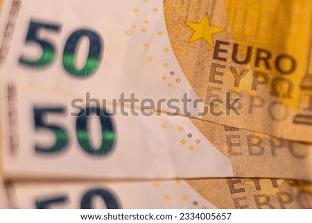 A fifty euro banknote. Euro money macro close-up. Separate news about the European Union euro cash, which has a nominal value of fifty euros. Savings for the concept of financial freedom.