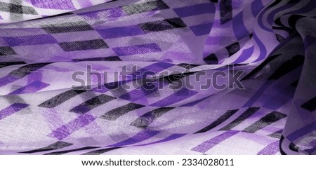 White silk fabric with purple and black geometric rhombus shapes. abstract drawing blue franc, closeup, background for design, vintage bright pattern. Texture. Background. Template.