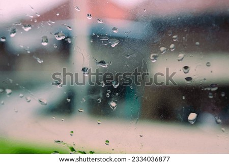 splashes of rainwater on the glass of the housing