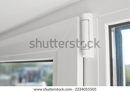 White hinge connector of PVC window frame. Window frame Furniture elements. Mechanism of white plastic window sash. Plastic window profile inside Royalty-Free Stock Photo #2334055505
