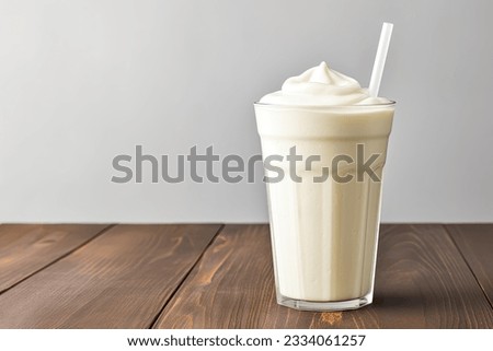 Vanilla cocktail with whipped cream in a tall glass on wooden table. Background with copy space, 3d rendering Royalty-Free Stock Photo #2334061257