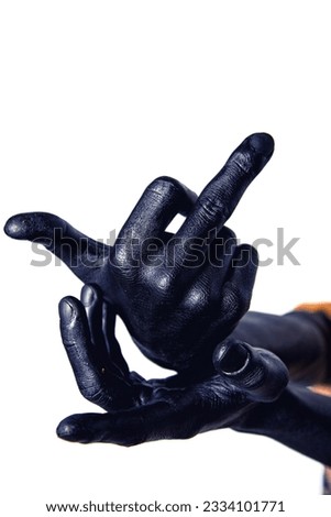 Hands in black paint on a white background.