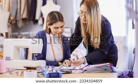 African american Designer Woman Using Laptop Computer And Taking Notes Working Online Sitting In Modern Office. Clothing Design Software And E-Learning, Fashion Design And Tailoring Concept.
