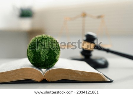 world and wooden gavel with a golden scale for law international environmental concept of business corporate and industry. law world for environmental regulation.sustainable environment concept Royalty-Free Stock Photo #2334121881