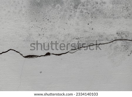 Horizontal cracks on the wall surface.