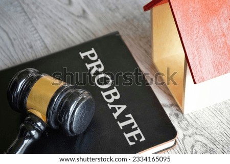 Toy house, gavel and text PROBATE. Real estate and law concept Royalty-Free Stock Photo #2334165095