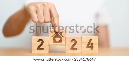 Happy New Year 2024 with Home and Heart block. Property investment, House Mortgage, Real Estate tax, homeless, donation, Financial and happy family concepts Royalty-Free Stock Photo #2334178647