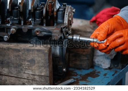 Close shot for repairing motor engine in car service