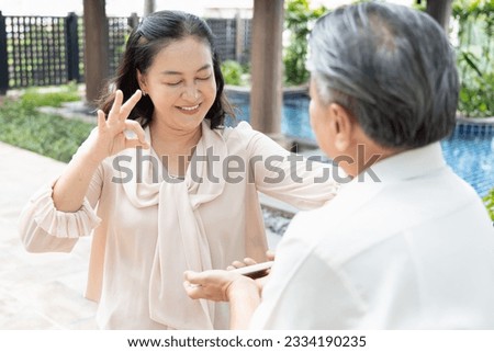 Successful Photography, Asian Senior Man's Approved Picture of His Senior Wife Taken with a Smartphone, happy senior family togetherness concept