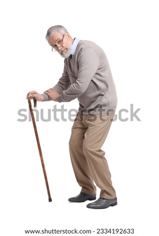 Stooped senior man with walking cane on white background Royalty-Free Stock Photo #2334192633