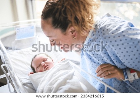 A New born baby boy resting in little bed in hospital Royalty-Free Stock Photo #2334216615