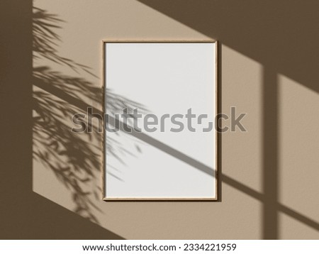 Mockup wooden vertical poster frame close up on wall and leaves tropical shadow