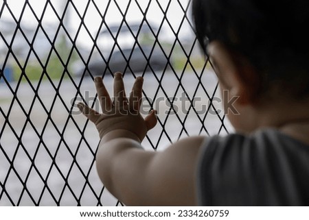 Detention Of Children. background for advertisement and wallpaper in baby safety and protection scene. Actual images in decorating ideas Royalty-Free Stock Photo #2334260759