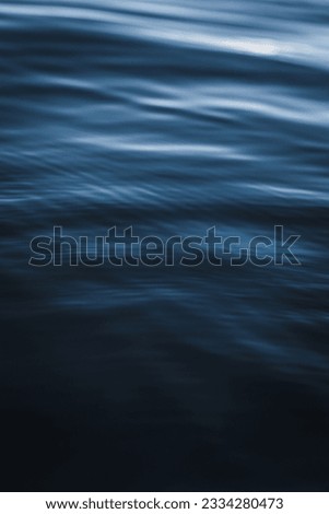 A vertical closeup of dark blue water texture at Lake Tahoe, California