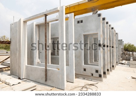 Prefabricated concrete walls for building office buildings and residential houses. Precast reinforced concrete wall panel for construction building.  Royalty-Free Stock Photo #2334288833