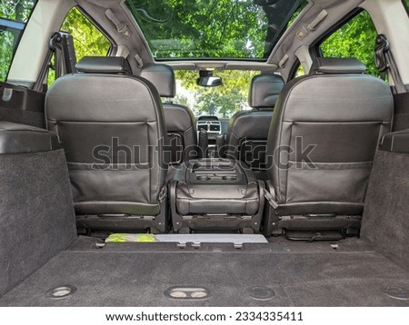 Interior of a car with a sun roof and great outside visibility