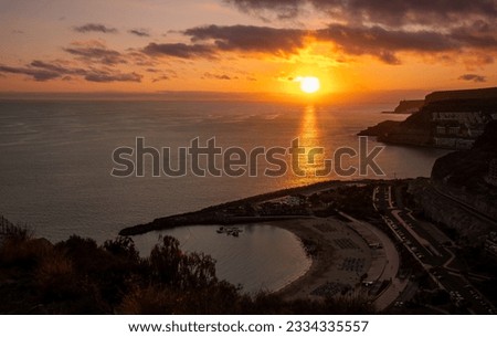 Spectacular sunset from Puerto Rico, Gran Canaria. Below the incredible beach of Amadores. Spain Royalty-Free Stock Photo #2334335557