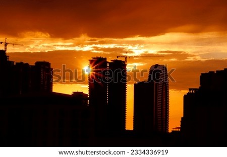 City evening landscape with sunset. Sunset is in the town.