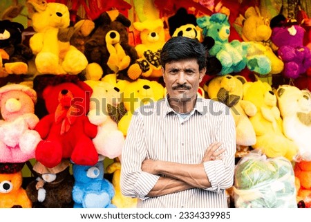 Indian roadside soft toy shop, seller looking at camera Royalty-Free Stock Photo #2334339985