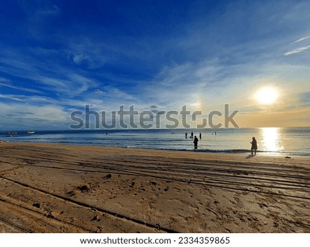 The portrait picture of human chilling on the sunset beach
