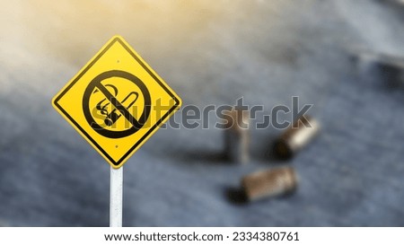 The graphic of no smoking on yellow sign with blurred bullets and blue in background concept of beware of shooting range                             