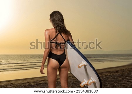 Surfing. Girl surfer. Download a photo with copy space to advertise tours to a warm country. Surfing and vacation picture for social media promo.