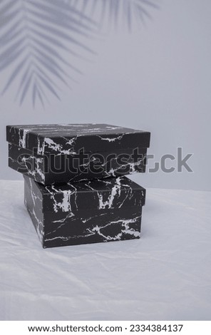 Blank black cardboard boxes for good and gifts. boxes for packaging goods from stores. Festive packages