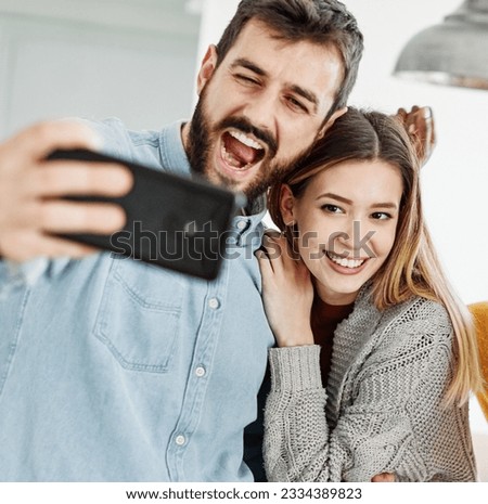 Group of young happy people with mobile phones taking making a selfie photo and having fun together