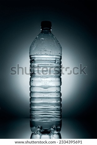 A back lit photograph of bottled water.