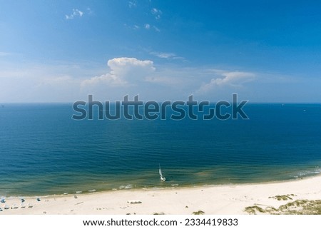 Aerial view of a sailboat on the beach at Fort Morgan, Alabama Royalty-Free Stock Photo #2334419833