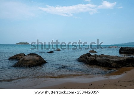Rocks in the sea blue water 
