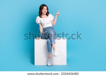 Full length photo of pretty cute lady wear white blouse pointing finger empty space isolated blue color background