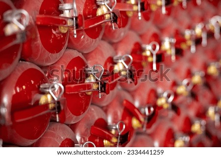 many red powder fire extinguishers
