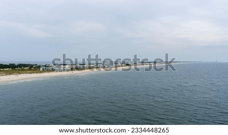 Aerial view of the beach at sunset in Fort Morgan, Alabama