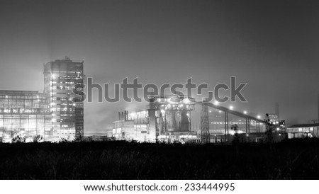 Petrochemical plant in night. Long exposure, monochrome photography 